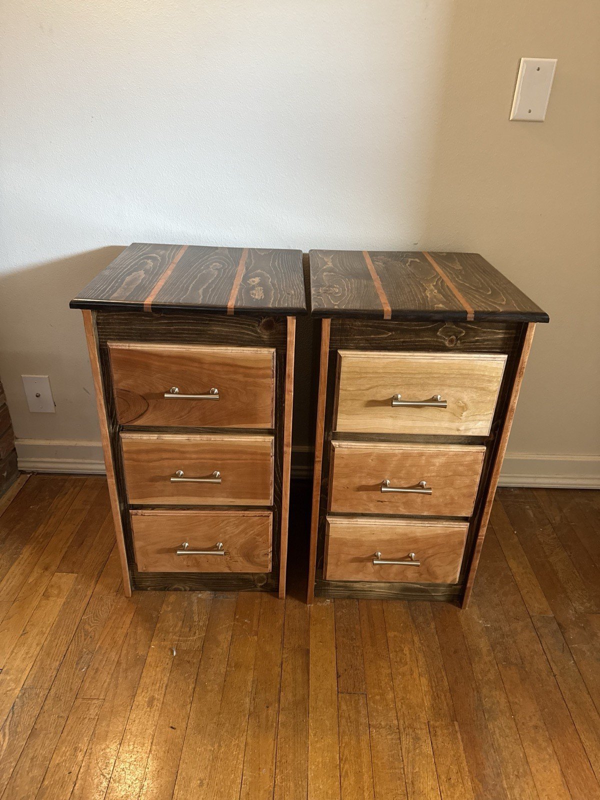 Custom-built matching cherry wood nightstands with stained frames